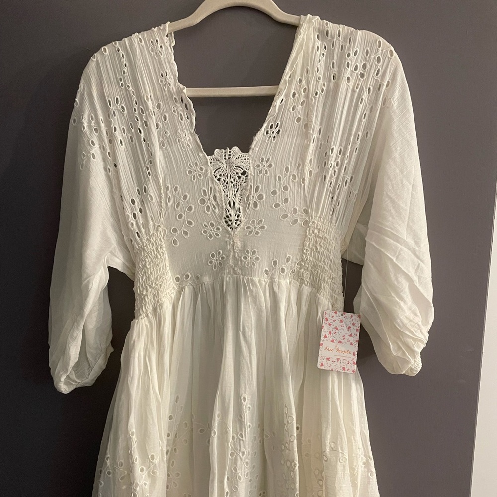 Ivory FreePeople NWT fit and flare dress: 3/4 length sleeves and lace-up back